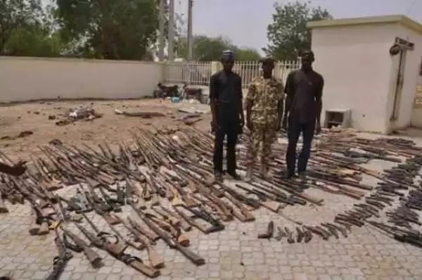 OMG!!! Repentant Bandits In Zamfara Surrender Dangerous Guns To The Soldiers In the State (PHOTO)
